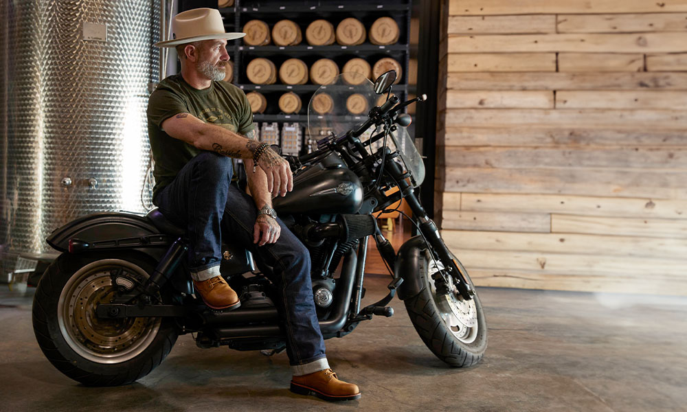 A man wearing a Classic Chippewa boot in tan.